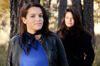 Close-up portrait of mother and teenage daughter